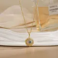 Close-up of golden sun-shaped pendant with turquoise evil eye and crystal inlays - Vintage Sun Evil Eye Style (XL02169)