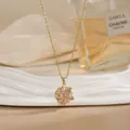 Detail of a rotating flower necklace with pink marquise gems and gold titanium steel - Pink Marquise Gem Floral Style (XL02170A)