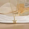 Detail of star-shaped pendant necklace with cubic zirconia pavé and gold chain - Pave Five-Pointed Star Style (XL02177)