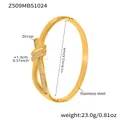 Dettaglio del bracciale a nodo in acciaio dorato con zirconi e info sulle dimensioni - Bracciale a Nodo Oro (Z509)