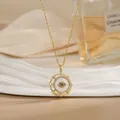 Gold spinning flower necklace with blue evil eye pendant and white mother of pearl - Mother of Pearl Evil Eye Style (XL02194)