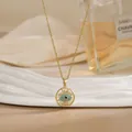 Golden evil eye necklace with rotatable flower design and blue central stone inlay - Radiating Cross Evil Eye Style (XL02198)