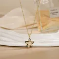 Golden rotating flower pendant necklace with white crystals and black enamel finish - Black Enamel Edge Cat's Eye Style (XL02199)