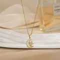 Elegant gold spinning necklace with moon and star pendant featuring inlaid crystals - Moon and Star Hugging Style (XL02202)