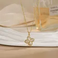 Elegant gold spinning flower necklace with marquise-cut crystal clover pendant - Marquise Gem Four-Leaf Clover Style (XL02205)