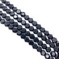 Macro detail of faceted black natural stone beads arranged in diagonal rows for DIY jewelry - 8x8x5mm Approx 26 Beads / Black Agate