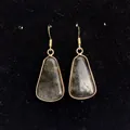 Macro detail of trapezoid labradorite stone set in gold frame on classic ear hooks - 16x30mm / Dark Gray