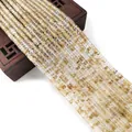 Polished natural golden rutilated quartz cube beads arranged in rows for DIY jewelry - 2x4mm / No. 15 (Golden Rutilated Quartz Cube)