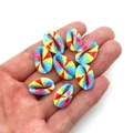 Rainbow gradient spiral shell beads held in hand for jewelry DIY accessories - Number 2