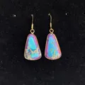 Rainbow marbled natural stone earrings with gold trim on a black display stand - 16x30mm / Blue and Purple