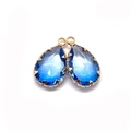 Blue gradient faceted teardrop crystal pendant with gold plating and prong setting - US 5