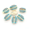 Macro shot of seven hand-painted natural cowrie shells with blue base and red polka dots - 9x19mm (20 Pieces/Pack) / Sky Blue with Orange Polka Dots (No.3)