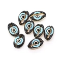 Macro view of hand-painted evil eye shell beads for DIY necklace jewelry making - Black Blue White Eye (Style 8)
