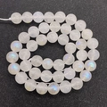 Polished 8mm white moonstone beads with strong blue and green iridescent flash effect - US 6 / White (No. 2)