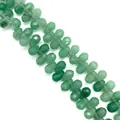Macro detail of faceted green aventurine teardrop beads for DIY jewelry making - 6x9mm / Green Aventurine