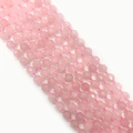 Macro detail of faceted rose quartz beads with soft pink hue for DIY jewelry design - 8mm / Rose Quartz