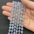 Faceted lavender quartz beads with silver spacers held by hand for jewelry DIY - Aquamarine