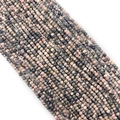 Macro shot of faceted natural pink and black stone beads for DIY jewelry making - Rhodonite with Black Lines