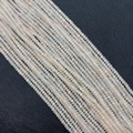 Faceted 2x3mm creamy white and pink natural stone beads in parallel strand layout - Pink Aventurine