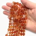Faceted natural stone beads in reddish-orange finish for DIY jewelry making - Watermelon red
