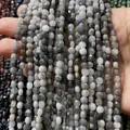 Perles plates rondes en pierre de lune grise polie avec texture naturelle unique - 4mm 93pcs/Brin 7g / N° 32