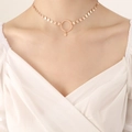 Collana choker in oro rosa con ciondolo ad anello centrale e una piccola stella pendente - Collana Lustrini Oro Rosa