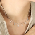 Elegant silver-tone irregular chain necklace featuring delicate leaf-shaped pendants on a model - 40+5cm / Steel Color (Silver)