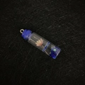 Pink dried flower glass bottle pendant with blue base and silver loop fastener - Dark Blue Cap Blue Liquid Style
