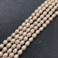 String of natural freshwater rice pearls in a soft pink hue for DIY jewelry - 3-4mm / Pink