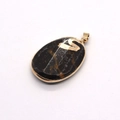 Detail view of oval black stone pendant with golden swan motif and metallic gold rim - Black Rhinestone Swan Pattern Style (No. 1)