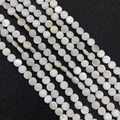 Close-up of polished white mother of pearl round flat beads for DIY jewelry making - Disc Shape (6mm)