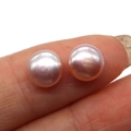 A pair of 11-12mm pink-purple freshwater pearls held between fingers for size reference - 2-2.5mm (0.5g/Pair) / Pink