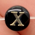 Black round letter bead with golden engraved X on transparent elastic string - Letter X / 8mm