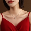 Minimalist silver-tone titanium steel necklace with a round prong-set zircon pendant - Steel