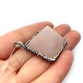 Square pink quartz stone pendant with sparkling rhinestone frame held in palm for scale - Rose Quartz (No. 5) / 36mm Thick 20mm
