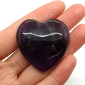 Handheld 40mm heart-shaped natural amethyst stone with deep purple hues and polished finish - 40mm Thick 10mm, 22g / Deep purple