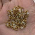 Golden copper chain with faceted semi-transparent moonstone beads held in hand - 10m/Roll / No.3 (White)
