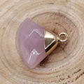 Pink quartz stone fan-shaped pendant with gold-plated clasp on a natural wooden surface - Rose Quartz