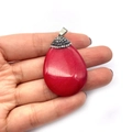Waterdrop-shaped red gemstone pendant with silver micro-pave faux diamonds held in hand - No.1 (Red)