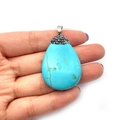 Blue teardrop stone pendant with gold veins and sparkling crystals on a silver bail - Blue Turquoise