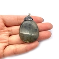 Handheld view of a large teardrop labradorite pendant with a diamond-encrusted silver cap - No.10 (Labradorite Color)