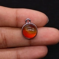 Macro detail of a round tiger eye stone pendant with metallic silver-plated edging - 12x15mm, 2g / Red Agate (7)