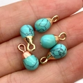 Blue turquoise water drop pendants with gold metal loops held in hand for DIY jewelry - Blue Turquoise Gold Cap Style (5037910906835)