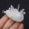 Natural white crystal cluster pendant with silver wire wrap held in hand for scale - Style 2 (1003-T220112008) / 37x48mm