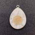 Water drop white turquoise pendant with silver frame and golden geometric metal overlay - Geometric Pattern