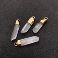 Set of four natural white crystal pillar pendants with gold electroplated metal caps - Gold