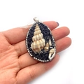 Waterdrop shell pendant with black natural stones and rhinestones shown in hand - Black Crystal Base Style (No. 1)