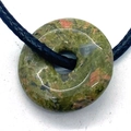 Natural Unakite stone donut pendant with green and pink texture on black cord - Unakite