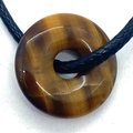 Tiger eye stone donut pendant with black cord necklace showing natural golden brown texture - Tiger's Eye