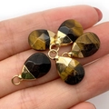 Faceted tiger eye teardrop pendants with gold metal caps held in hand for scale - 10x19mm 1g/pc / Tiger's Eye